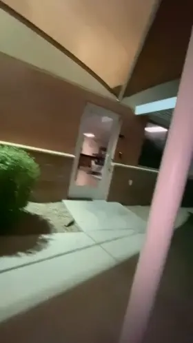 Jerking off in front of a building