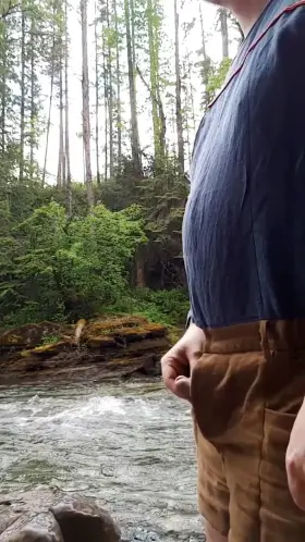 Stripping by the river in the rain [m]