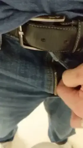 Bound foreskin with hair tie, urinal piss