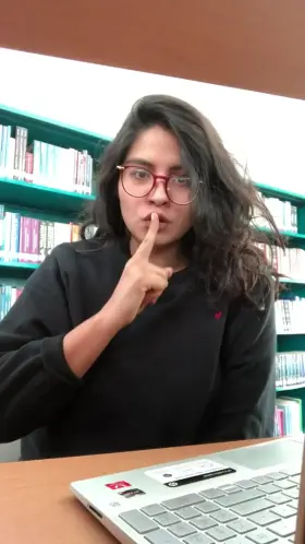 Showing off boobs in the library