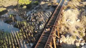 Playing on some abandoned train tracks while wearing my plug.