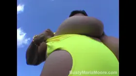 Maria having fun with her big oiled breasts.