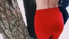 Babe in red leggings gets fucked from behind outdoors