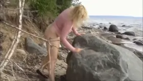 Blonde MILF prepares the beach for hard fuck