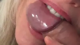 Biting his cock as he cums