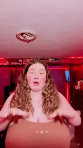 Chubby girl grabbing her massive jugs