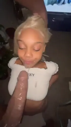 Locking her lips around the his dicks.