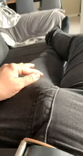 Tracing the outlines of my thick cock under my jeans…