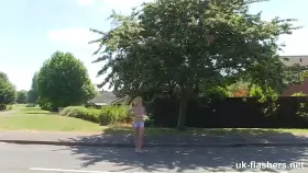 Showing off her tits outside