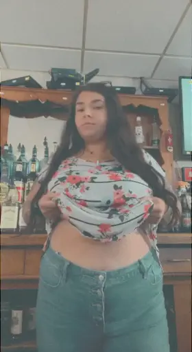 Flashing and playing with my tits between customers has me so fucking horny