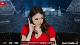 Riley Reid is interrupted during her sports coverage