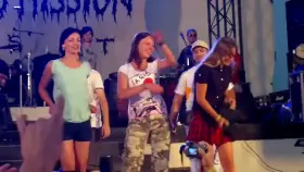 Three girls stripping on stage