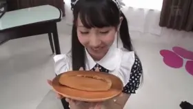 Cute Asian eats a hotdog