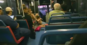 Guy playing candy crush while lesbians are eating themselves