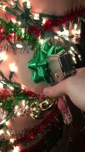 Decorating the Slutmas tree with hot lights crotch rope, heavy bells on nipple piercings, and bows stapled into its flesh.