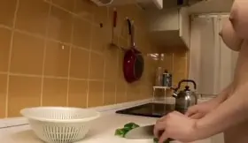 In the kitchen cutting some bell peppers