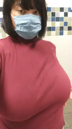 Flashing my huge tits in the restroom 😋