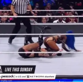 Sasha sitting on Shotzi’s face