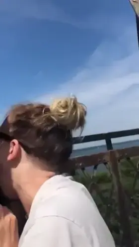 Blowjob on top of a lighthouse with boats around
