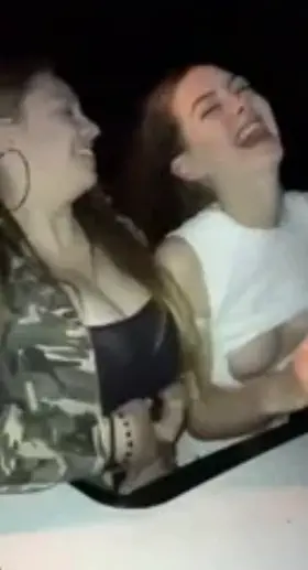 Two Girls Ride Roller Coaster And Show Their Tits