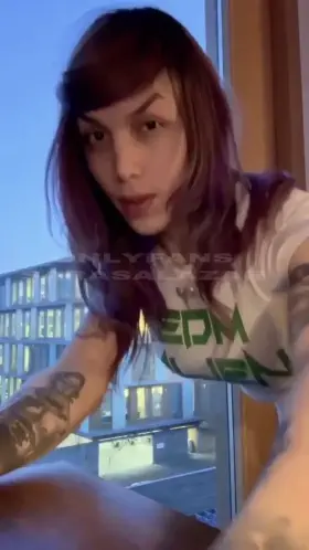 Trans girl licks the window after cumming
