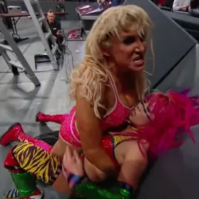 Asuka getting a face full of Charlotte’s tits