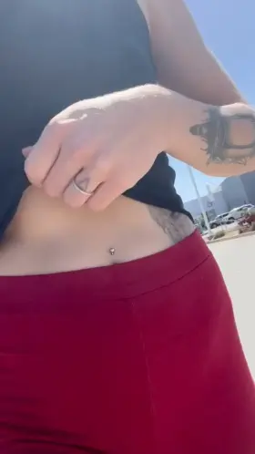 Flashing my perky tits to the car salesmen and people driving by :)