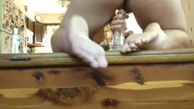 Riding a Clear Dildo in Front of a Large Window