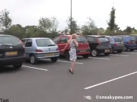 Desperate blonde pees in the parking lot