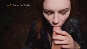 Busty redhead babe giving blowjob in public