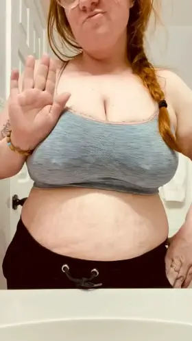 Chubby redhead with big pierced tits!