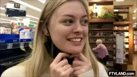 Happy Embarrassed Girl Flashing in a Store