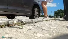 Teasing in a short skirt at the service station