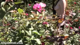 One boob out at a public garden