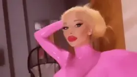 what do you think of my new skinsuit? pretty sexy huh? i got it custom made to have a pink latex catsuit as the skin. it feels so good to have this slick shiny pink skin with these big bolt on tits. i’m totally ready to give it a test run