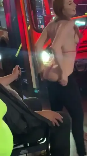 Redhead gives a lap dance to a stranger at the bus stop