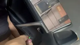 Footjob in the car while people walk by