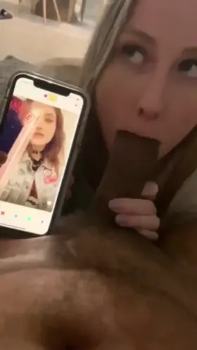 My slut knows what I'm doing on my phone while she blows my cock.