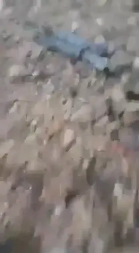 [NSFL] Footage showing the charred remains of a Syrian Army bulldozer operator. 2019.