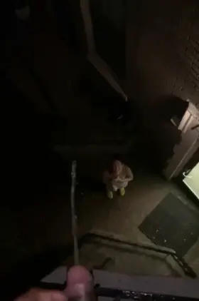 Late night peeing in her mouth from the balcony