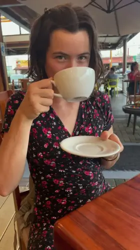 She couldn't resist a little taste, even while she's in public