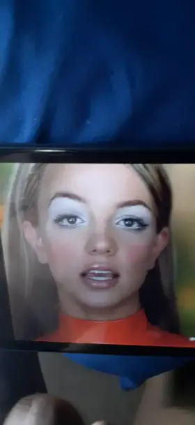 Covering Britney's slutty face with a nice load.