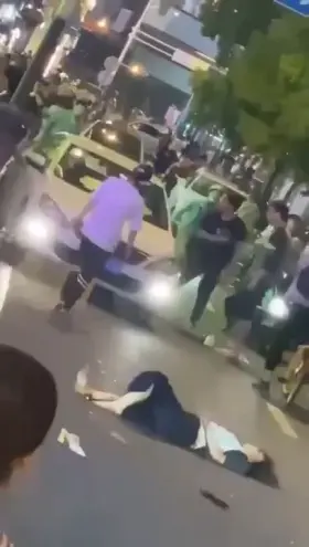 Woman gets run over as she lays injured on the road