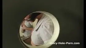 Busty slut fingers pussy while sucking Gloryhole cock