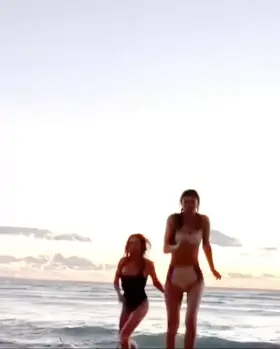 Running on beach with Alexandra Daddario
