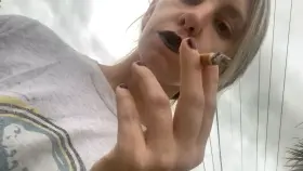 Black lipstick 🖤 smoking down to the filter again