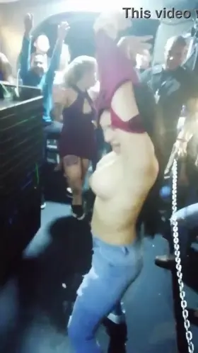Flashing fake boobs at a club