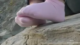 My jeans feet in cute pink ankle socks on the seashore