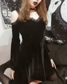 Gothic girl has a surprise under her dress