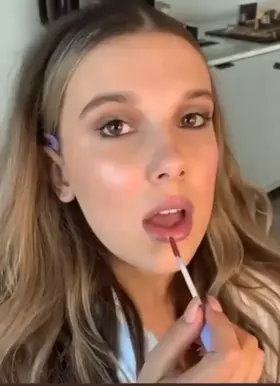 Millie Bobby Brown teasing those lips on purpose 🤤